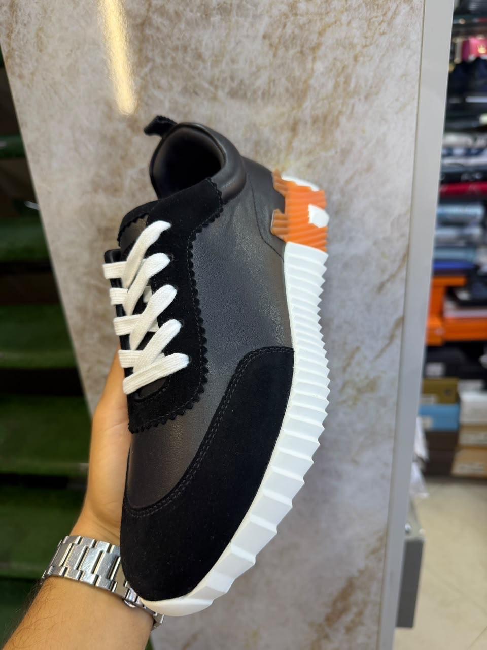 Sneakers crantées · Noir & orange